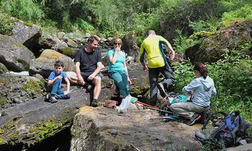 An international family enjoying a private ecotour with Lijiang Cloud Mountain.