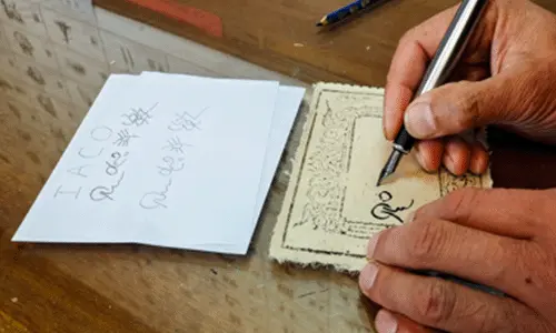 Brush and paper for writing Dongba pictographs
