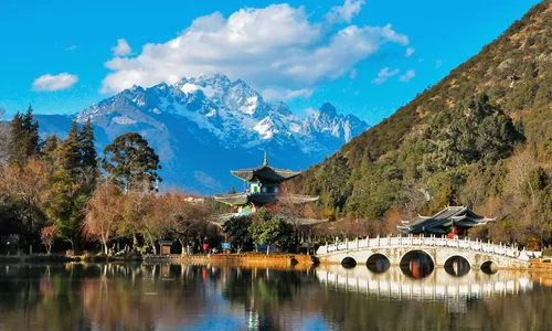 Black Dragon Pond in Lijiang with Jade Dragon Snow Mountain and the historic Moon-Arch Bridge